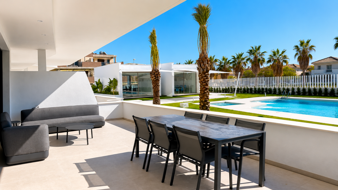 Terrace of a residential complex with a pool and landscaped gardens